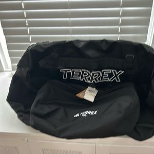 New with tags adidas Terrex 70L Duffel Bag never used.